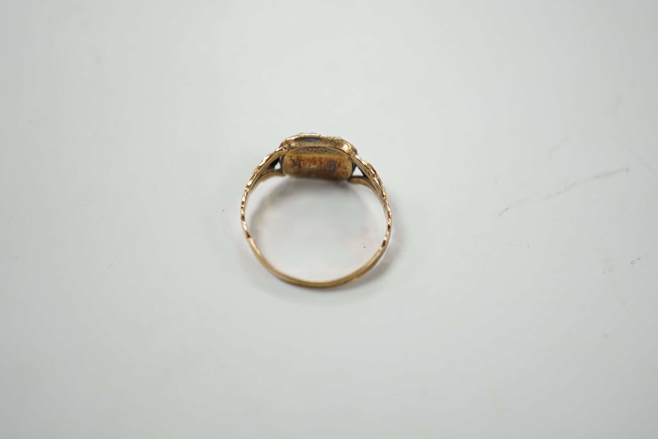 A 19th century yellow metal and two colour garnet? cluster set dress ring, size J, gross weight 1.6 grams.